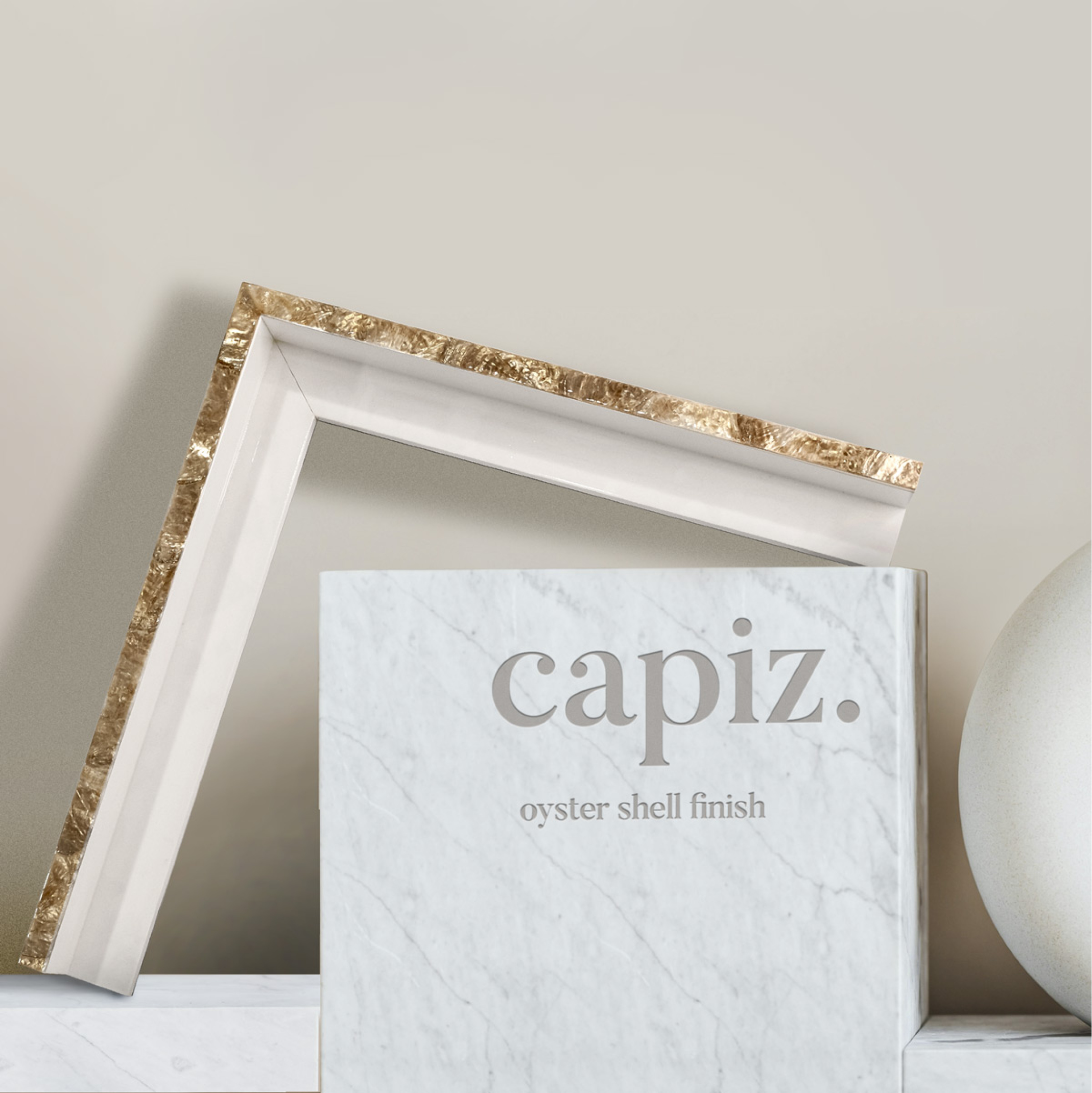 Custom frame created out of coastal oyster shells in champagne or white.