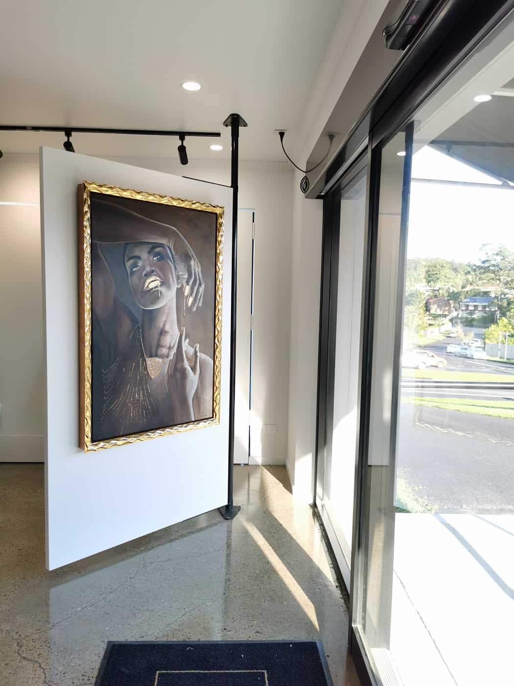 Nxesu Oil Painting of an African Woman with Gold Leaf dripping lips and jewellery framed in a 23ct gold handcrafted frame. Artist : Laark