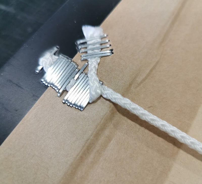 Too many staples used to secure a cord into a composite frame will weekend the frame material and can result in the artwork falling of the wall or the frame breaking and damaging the artwork.