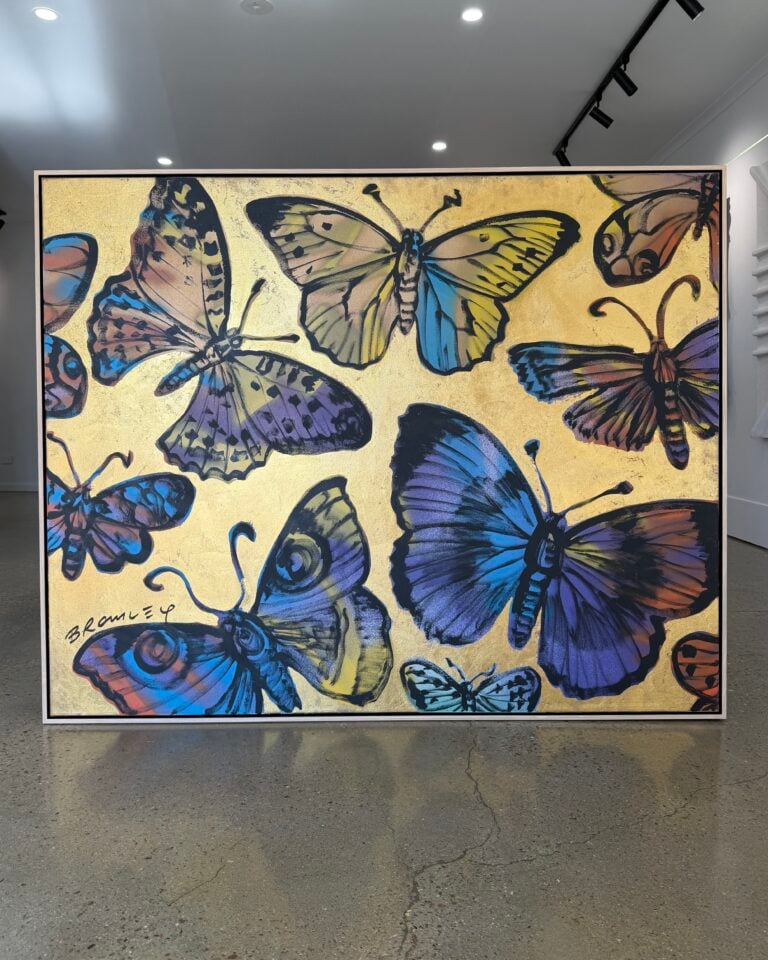 a metallic gold artwork with butterflies by Australian contemporary artist David Bromley, framed in an oak float frame with black inner edge custom made by Dawsons framing gold coast