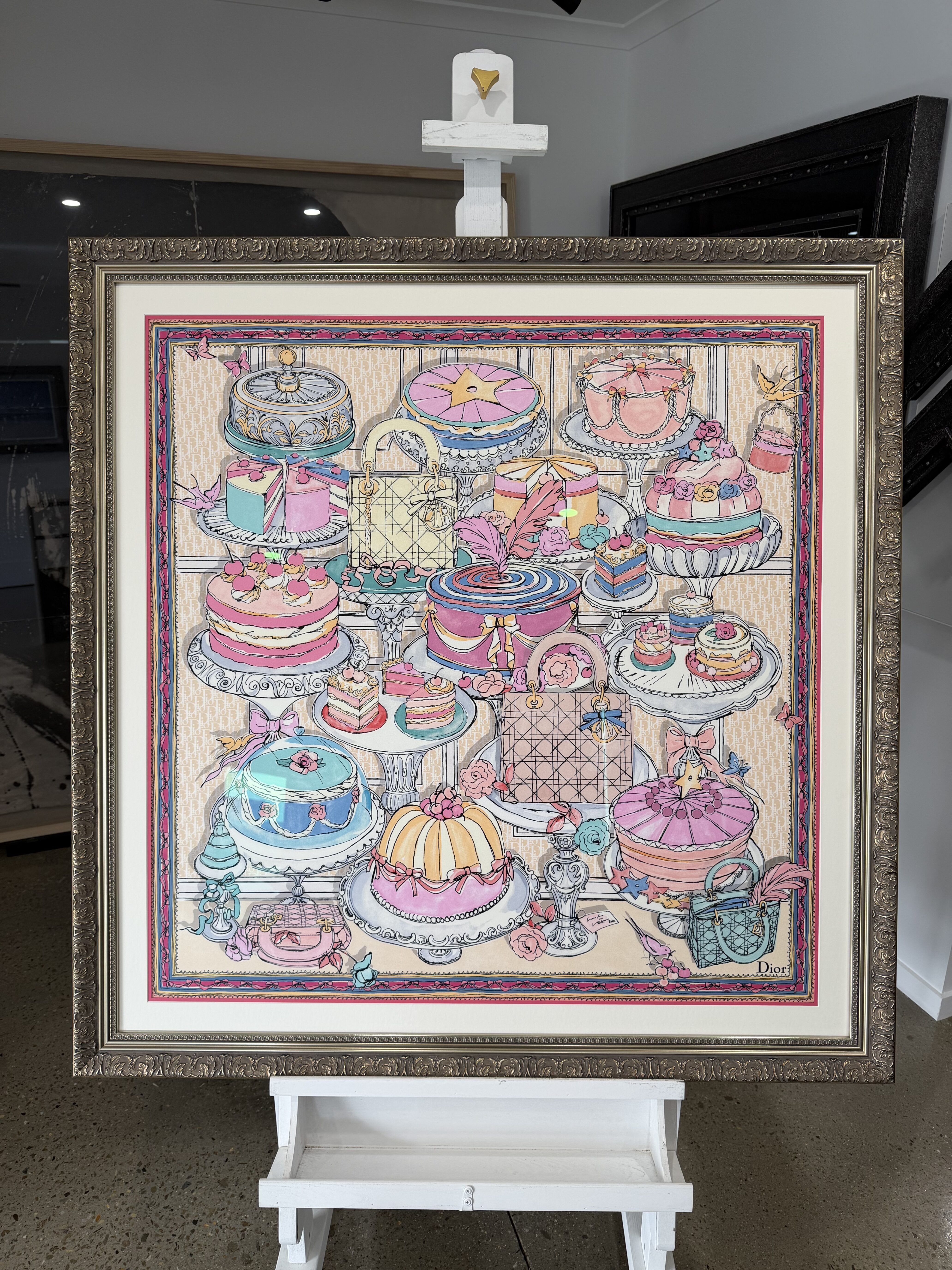A framed and mounted Dior silk scarf with pinline mat board detail and ornate silver frame at Dawsons Framing Ashmore
