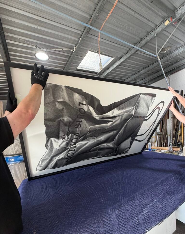 Preparing an extra large CJ Hendry original artwork at Dawsons Framing Gold Coast