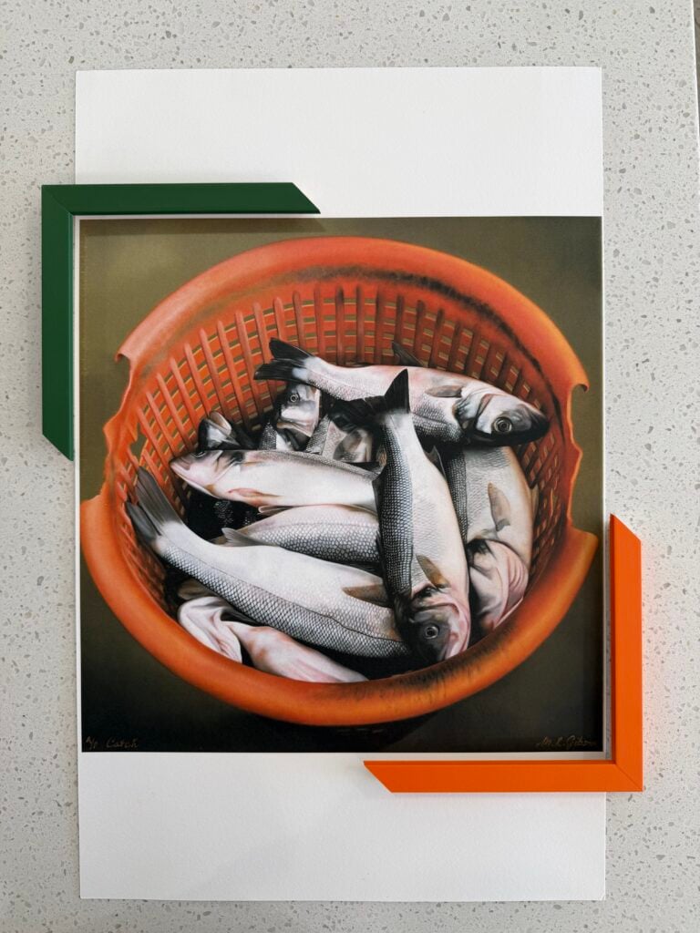 comparing two frame choices for sardine fine art print inside the Dawsons framing showroom Ashmore