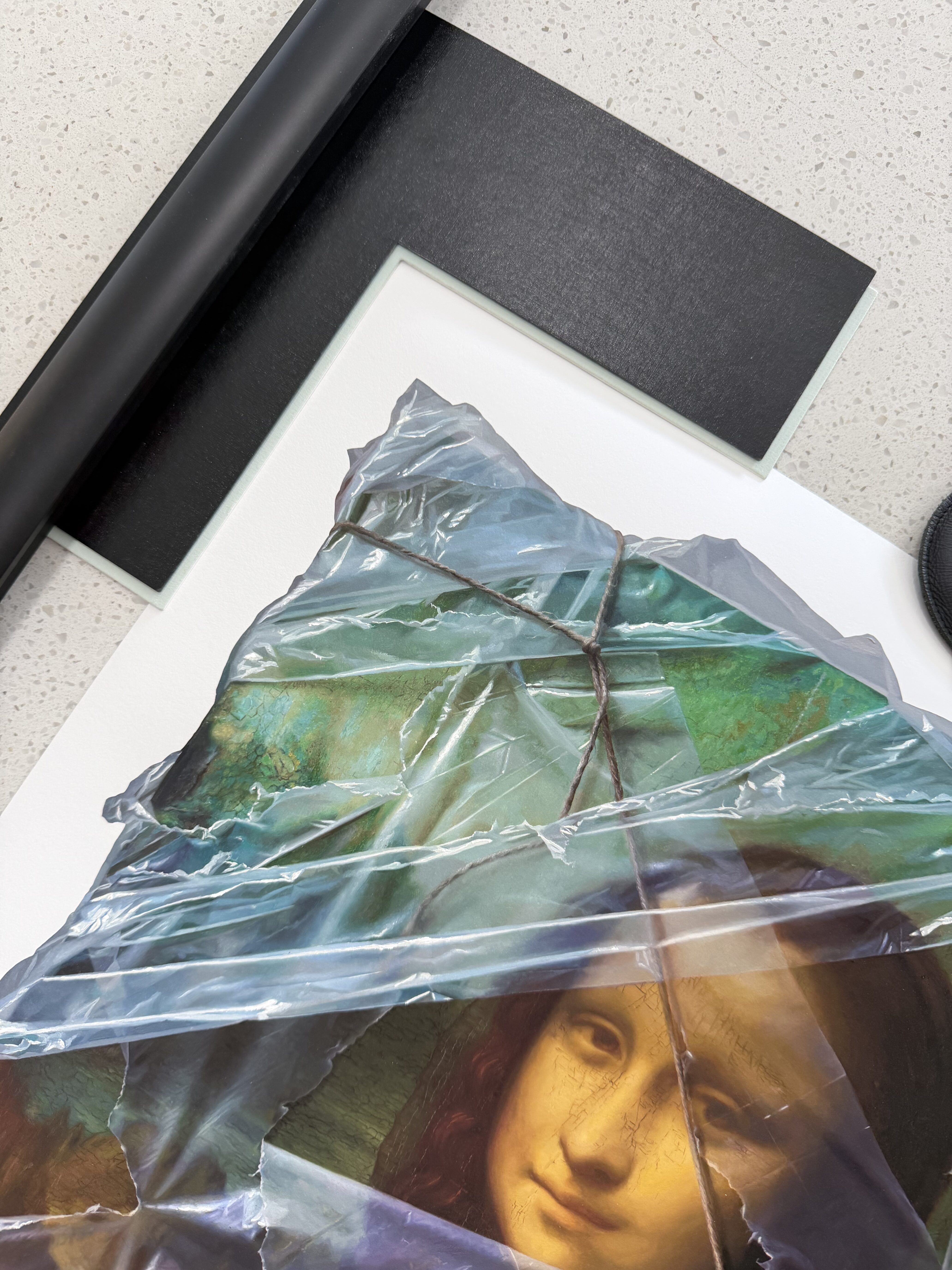 A Print of Mona Lisa (Wrapped) by Australian contemporary artist Robin Eley being matched with the perfect mat board and frame combination at Dawsons Framing Gold Coast