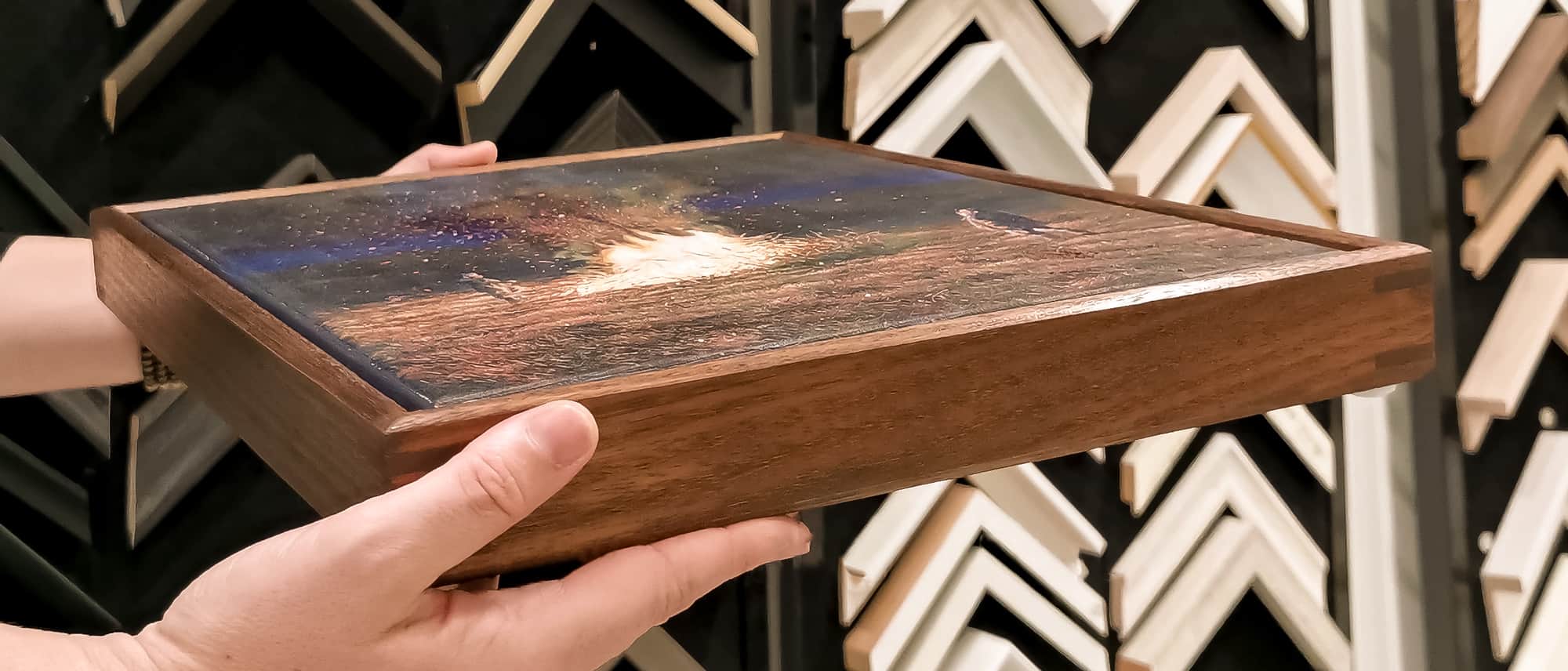 A custom design readymade floating frame completed by artist David Disher. The frame is crafted with rounded top edges and splined corners.